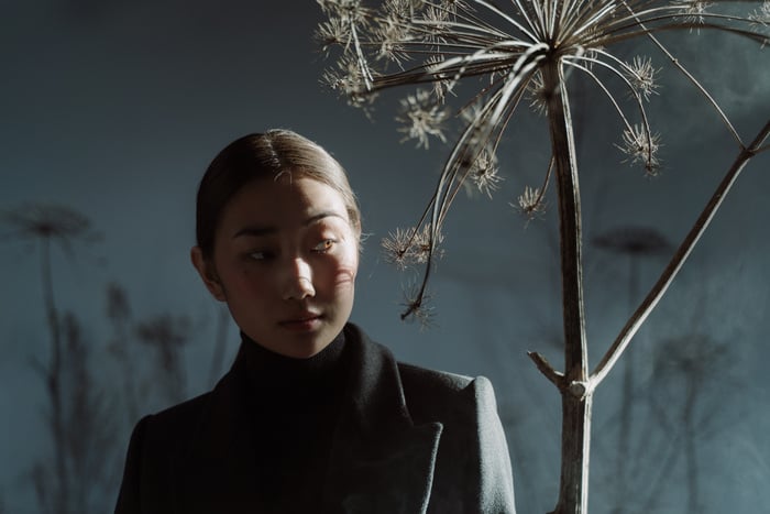 Close-Up Shot of a Woman in Black Coat