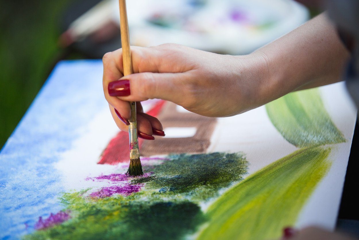 painter paints a painting